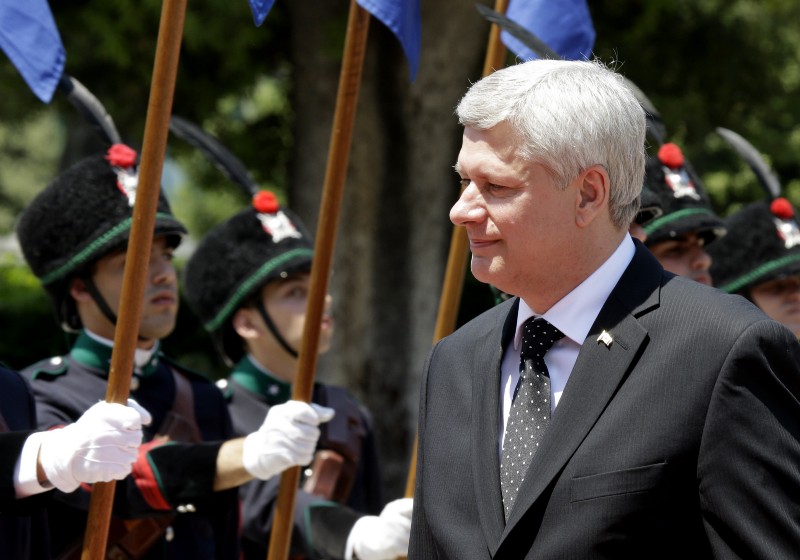 Canada’s Prime Minister Stephen Harper reviews the honor guard prior the meeting with Italian Premier Matteo Renzi in Rome, Thursday, June 11, 2015. CREDIT: AP PHOTO/ANDREW MEDICHINI