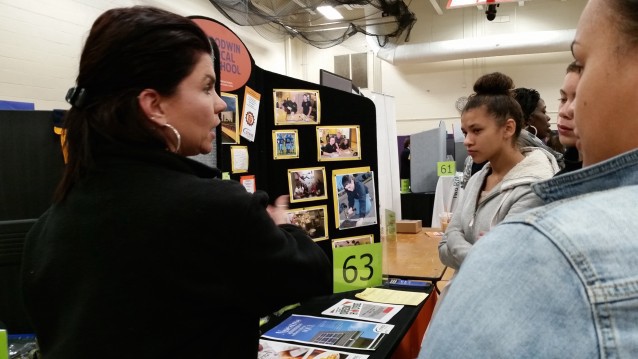 A student considering school options at the fair. CREDIT: Casey Quinlan