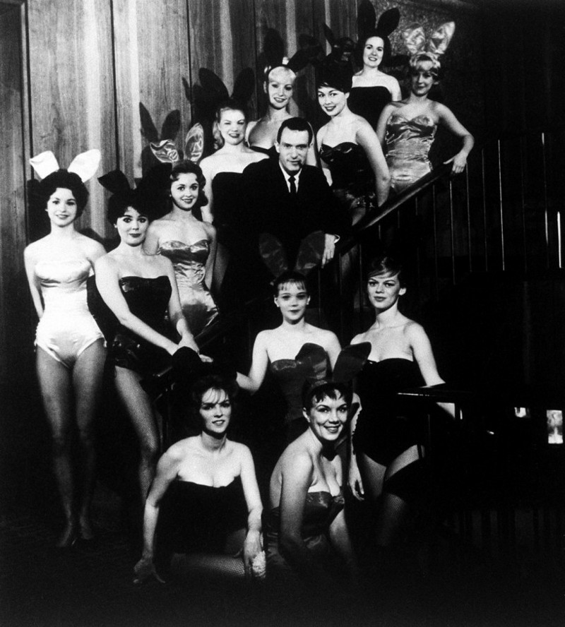 Hugh Hefner, founder and chairman of the Playboy Enterprises, Inc., is pictured amid a group of Bunnies, at the flagship Playboy Club, in Chicago, Ill., circa 1960. CREDIT: AP