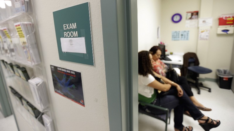 Two women wait in an exam room in San Juan, Texas CREDIT: AP PHOTO/ERIC GAY