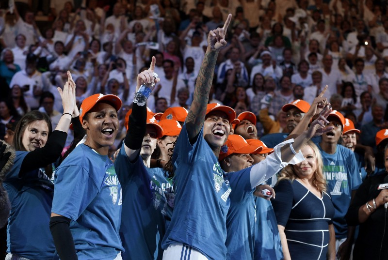 Minnesota Lynx players celebrate their 69–52 win over the Indiana Fever in Game 5 of the WNBA basketball finals, Wednesday, Oct. 14, 2015, in Minneapolis. (AP Photo/Jim Mone) CREDIT: JIM MONE, AP
