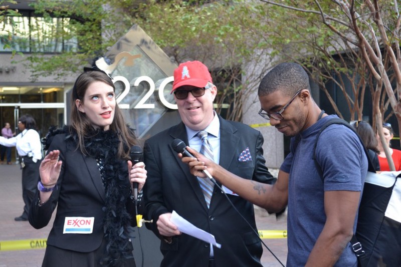 Protesters stage a performance about the role big oil companies play in the U.S. CREDIT: Jess Colarossi