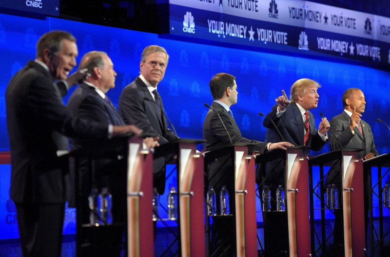 John Kasich, left, and Donald Trump, second from right, argue across fellow candidates during the CNBC Republican presidential debate at the University of Colorado, Wednesday, Oct. 28, 2015, in Boulder, Colo. CREDIT: AP PHOTO/MARK J. TERRILL