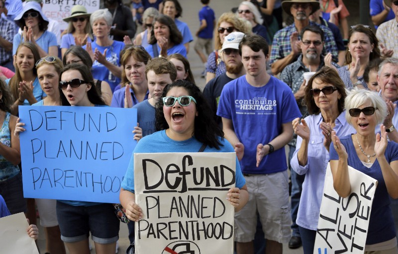 Anti-abortion protesters rally on the steps of the Texas Capitol to condemn the use in medical research of tissue samples obtained from aborted fetuses CREDIT: AP PHOTO/ERIC GAY, FILE