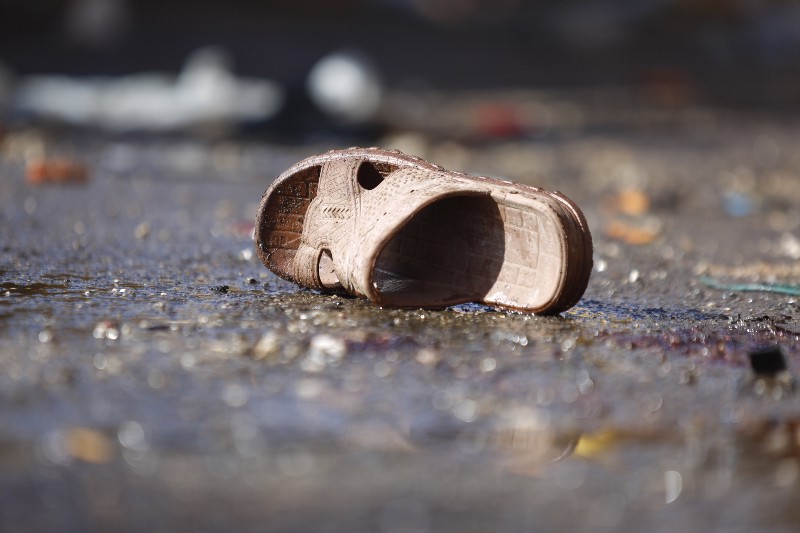The sandal of a victim lies on the ground, at the site of a Tuesday night suicide bomb attack, next to a mosque in Sanaa, Yemen, Wednesday, Oct. 7, 2015. CREDIT: AP PHOTO/HANI MOHAMMED