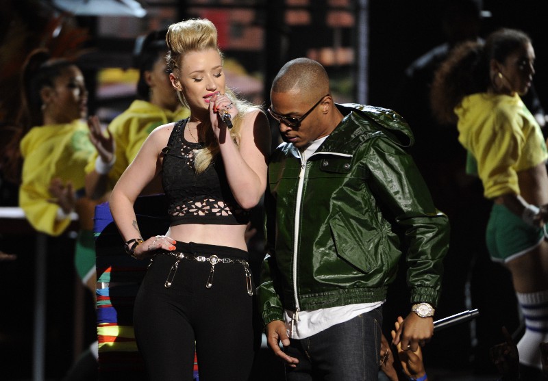 T.I., pictured here next to Iggy Azalea, said he thinks the Loch Ness monster has a better chance of becoming president than a woman. CREDIT: PHOTO BY CHRIS PIZZELLO/INVISION/AP