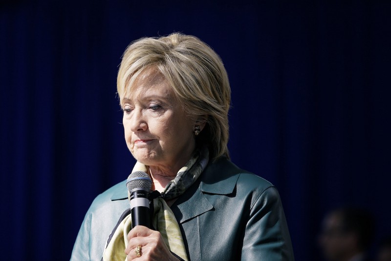 Progressives have pushed the idea of a Financial Transactions Tax into the mainstream in recent years. Clinton’s version appears to stop far short of that ideal. CREDIT: AP PHOTO/CHARLIE NEIBERGALL