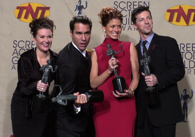 The cast of television’s “Will & Grace,” from left, Megan Mullally, Eric McCormack, Debra Messing and Sean Hayes pose with their awards for outstanding performance by an ensemble in a comedy series at the 7th annual Screen Actors Guild Awards in this photo taken March 11, 2001, in Los Angeles. CREDIT: AP Photo/Reed Saxon