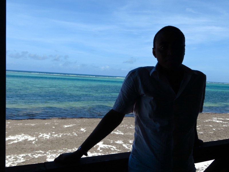 Kennedy, a gay man and sex worker, looks out at the ocean view from a Mombasa, Kenya hotel. CREDIT: THINKPROGRESS/BEENISH AHMED