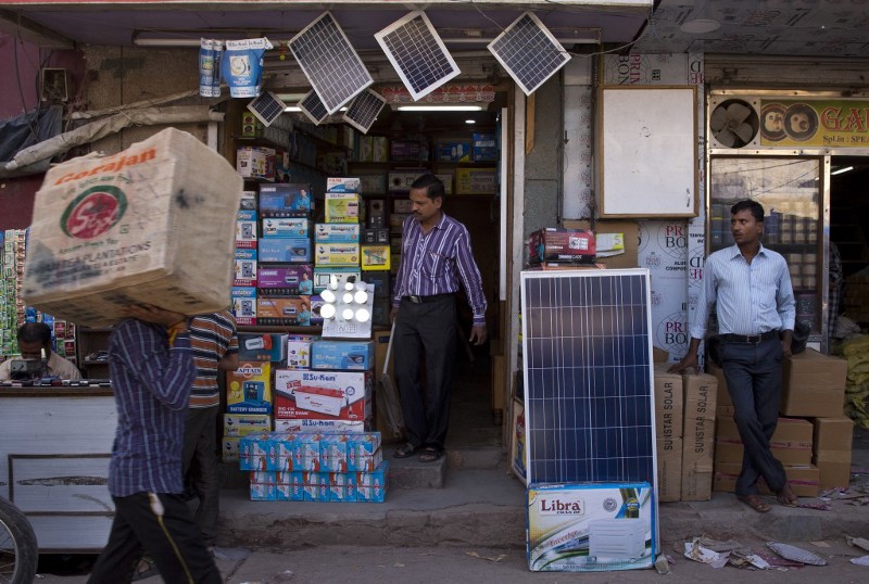 In this Oct. 1, 2015 photo, solar panels are displayed for sale at a market in New Delhi, India. India plans a fivefold boost in renewable energy capacity in the next five years to 175 gigawatts, including solar power, wind, biomass and small hydropower dams. CREDIT: AP PHOTO/SAURABH DAS