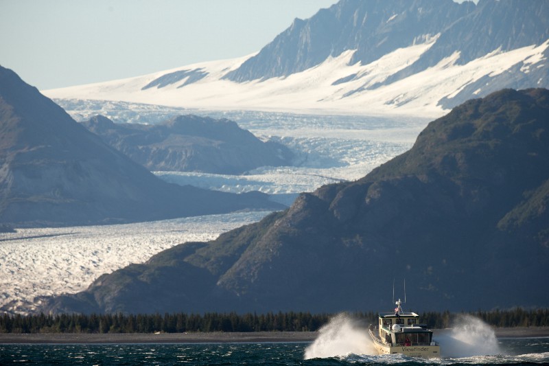 A boat carrying President Barack Obama makes its way to Bear Glacier, which has receded 1.8 miles in approximately 100 years while on a boat tour to see the effects of global warming in Resurrection Cove, Tuesday, Sept. 1, 2015, in Seward, Alaska. CREDIT: AP PHOTO/ANDREW HARNIK