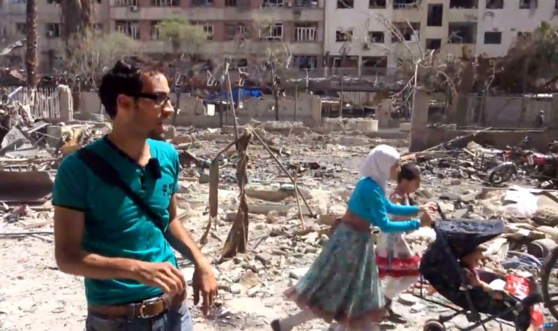 This image made from video posted online by the Shaam News Network, a loosely organized group opposed to Bashar Assad, on Sunday, Aug. 16, 2015, which has been verified and is consistent with other AP reporting, shows the aftermath of Syrian government airstrikes in Douma, a suburb of Damascus, Syria. CREDIT: SHAAM NEWS NETWORK VIA AP VIDEO