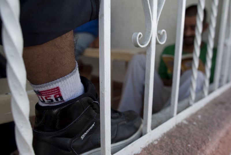 Deported migrants rest at the “Casa de la Divina Providencia” migrant shelter before breakfast in the border city of San Luis Rio Colorado, northern Mexico, Friday, July 30, 2010. On the surface, a judge’s decision to block tough provisions of Arizona’s immigration law was a defeat for the state’s Republican governor and a win for the Democratic Obama administration. (AP Photo/Guillermo Arias) CREDIT: AP PHOTO/GUILLERMO ARIAS