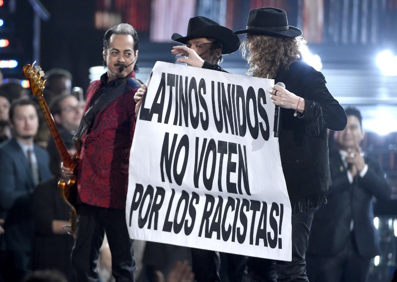 Los Tigres del Norte and Mana hold up a sign during a performance at the 16th annual Latin Grammy Awards at the MGM Grand Garden Arena on Thursday, Nov. 19, 2015, in Las Vegas. (Photo by Chris Pizzello/Invision/AP) CREDIT: PHOTO BY CHRIS PIZZELLO/INVISION/AP