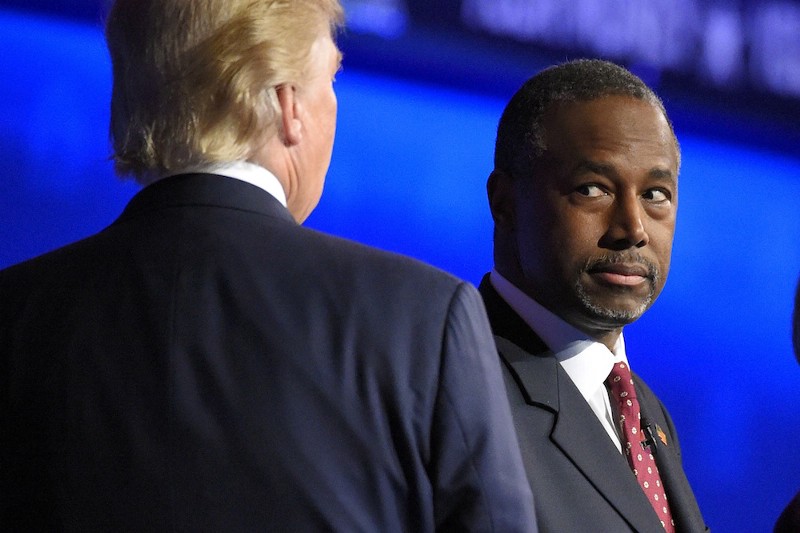 Ben Carson watches as Donald Trump takes the stage during the CNBC Republican presidential debate at the University of Colorado, Wednesday, Oct. 28, 2015, in Boulder, Colo. (AP Photo/Mark J. Terrill) CREDIT: AP PHOTO/MARK J. TERRILL