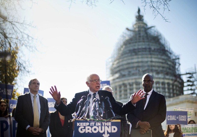 Democratic presidential candidate Sen. Bernie Sanders, I-Vt., center, and Sen. Jeff Merkley, D-Ore., left, announce new climate legislation, Wednesday, Nov. 4, 2015, during a news conference on Capitol Hill in Washington. At right is Sierra Club President Aaron Mair. CREDIT: AP PHOTO/PABLO MARTINEZ MONSIVAIS