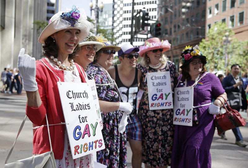 A group of women with the 1st Congregational Church of Sonoma, Calif., pose for pictures before the start of the 44th annual San Francisco Gay Pride parade Sunday, June 29, 2014, in San Francisco. The lesbian, gay, bisexual, and transgender celebration and parade is one of the largest LGBT gatherings in the nation. The church is a United Church of Christ. (AP Photo/Eric Risberg) CREDIT: AP PHOTO/ERIC RISBERG