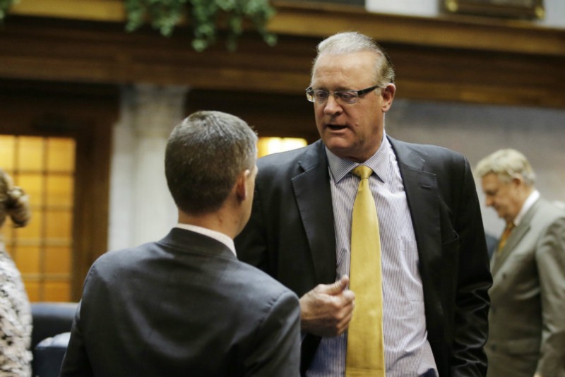 Indiana Sen. Jim Banks (R) speaks with Senate President Pro Tem David Long (R) on Tuesday. Long called the bill “an attempt to balance civil rights and religious liberty.” CREDIT: AP PHOTO/DARRON CUMMINGS