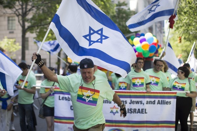Revelers in support of the LGBT community march up Fifth avenue during the Celebrate Israel Parade, Sunday, June 1, 2014, in New York. CREDIT: AP Photo/John Minchillo