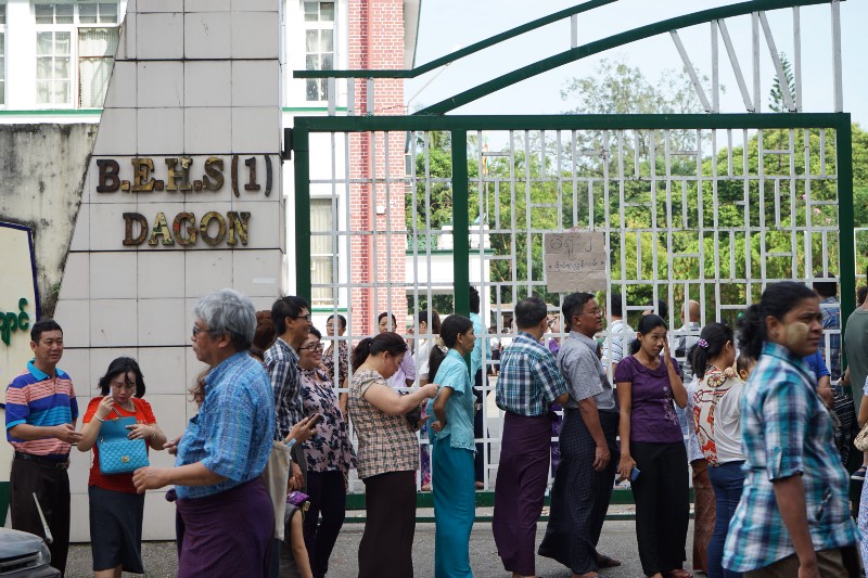 Voters wait in line to cast their ballots at a polling site in Dagon Township in Yangon, Myanmar. CREDIT: SABRINA TOPPA