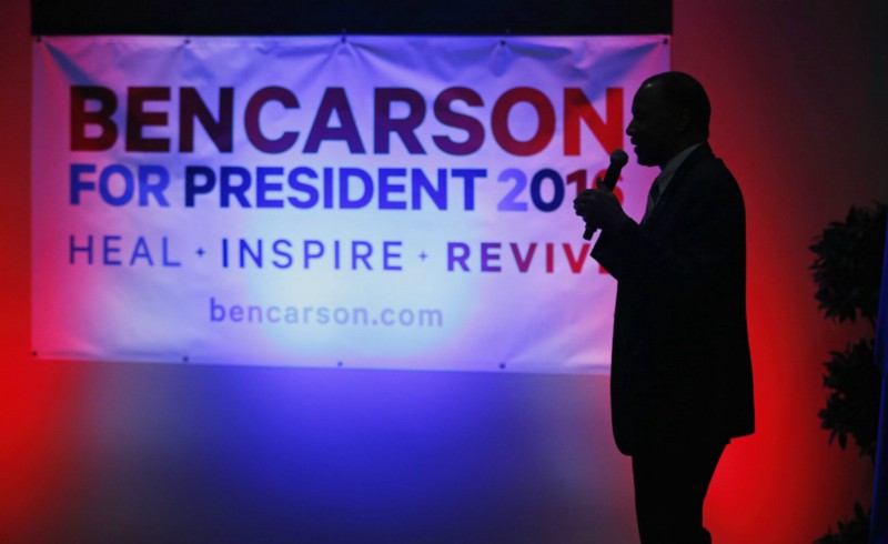Ben Carson (R) at a rally on Monday CREDIT: AP PHOTO/JOHN LOCHER