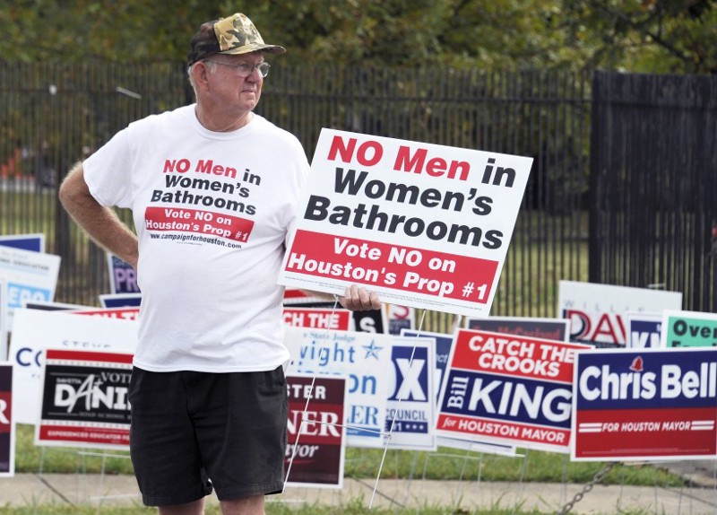 A man urges people to vote against the Houston Equal Rights Ordinance outside an early voting center in Houston on Wednesday, Oct. 21, 2015. CREDIT: AP Photo/Pat Sullivan