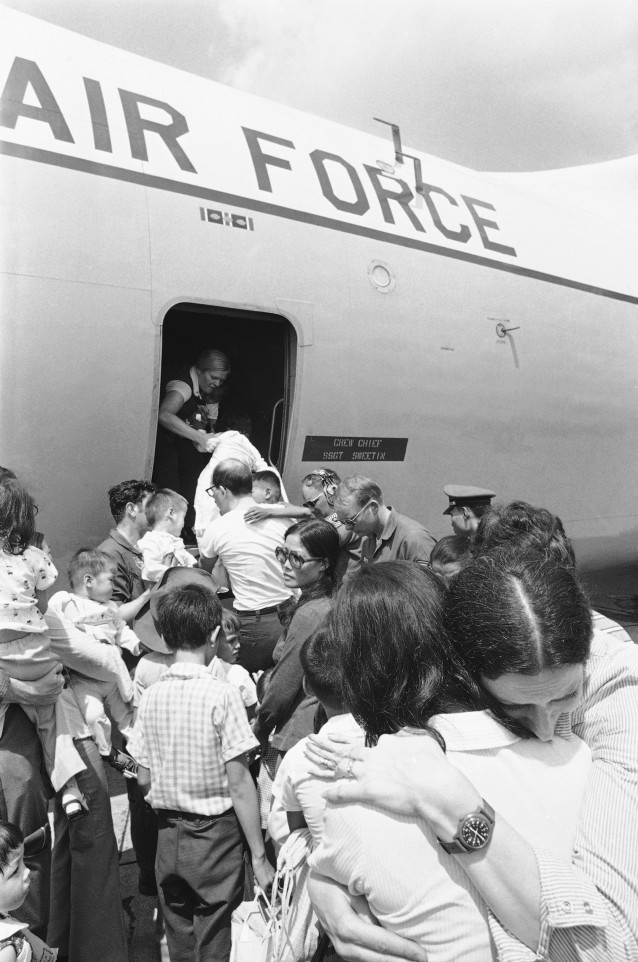 Actress Ina Balin, foreground, puts comforting arms around a Vietnamese mother whose child is being put aboard an American C-141, to be adopted in the United States, April 11, 1975 at Saigon’s Tan Son Nhut airport. (AP Photo/Neal Ulevich) CREDIT: AP Photo/Neal Ulevich