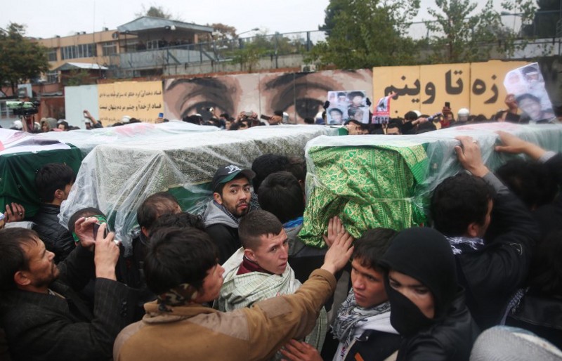 The coffins of ethnic Hazaras who were allegedly killed by the Taliban are carried during a protest march in the Afghan capital of Kabul on Wednesday, Nov. 11, 2015. CREDIT: AP Photos/Massoud Hossaini