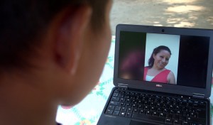 Teodora Vasquez son looks at her mother’s pictures in his family home in El Salvador. CREDIT: Amnesty International