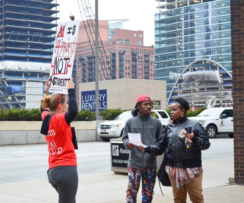 Ami Schneider talks to a parent and prospective student at an open house at the The Illinois Institute of Art-Chicago. CREDIT: Craig Hammond