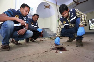 Investigators inspect a mosque that was attacked by unidentified gunmen during evening prayers on Thursday in northern Bangladesh’s Bogra district, Friday, Nov. 27, 2015. CREDIT: AP Photo
