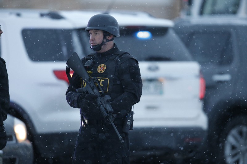 Police stand guard near a Planned Parenthood clinic Friday, Nov. 27, 2015, in Colorado Springs, Colo. A gunman opened fire at the clinic on Friday. CREDIT: AP PHOTO/DAVID ZALUBOWSKI