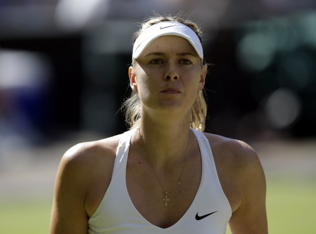 Maria Sharapova of Russia pauses during play against Serena Williams of the United States, during their women’s singles semifinal match at the All England Lawn Tennis Championships in Wimbledon, London, Thursday July 9, 2015. (AP Photo/Pavel Golovkin) CREDIT: Pavel Golovkin, AP