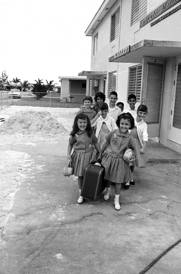 Led by twin girls, a new group of Cuban child refugees arrive on May 17, 1962 at their temporary home, the Catholic Refugee Center in Florida City, 35 miles from Miami. Each ticket for the flight from Havana to Miami cost $25. The child refugee flow adds up to a lot of American dollars for the Castro government, which has not tried to stop it. (AP Photo) CREDIT: AP Photo
