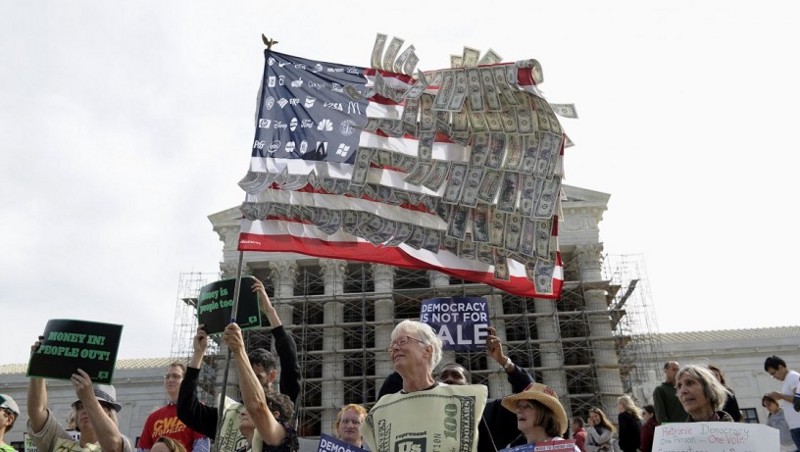 Demonstrators gather outside the Supreme Court in Washington, Tuesday, Oct. 8, 2013, as the court heard arguments on campaign finance. (AP Photo/Susan Walsh) CREDIT: AP Photo/Susan Walsh