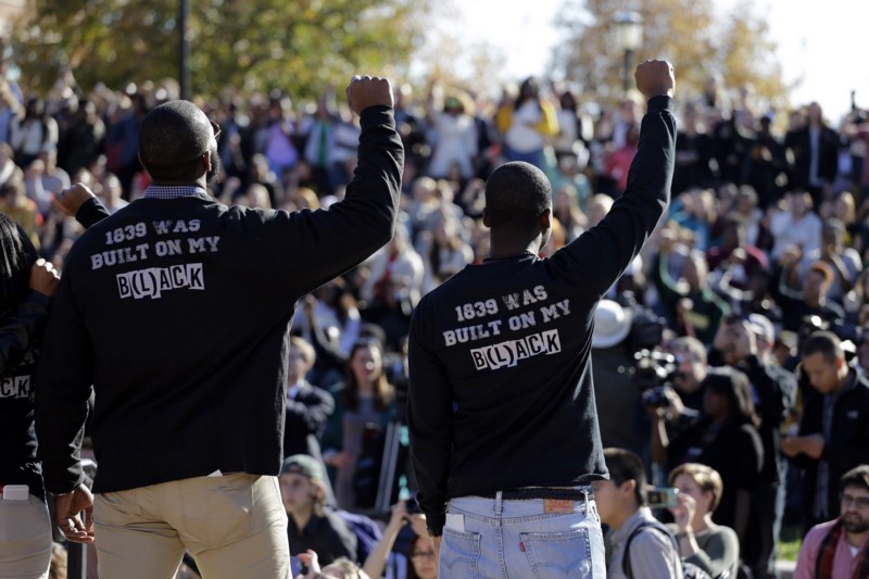 Members of the group Concerned Student 1950 address the crowd following the resignation of University of Missouri president Tim Wolfe. CREDIT: AP PHOTO/JEFF ROBERSON