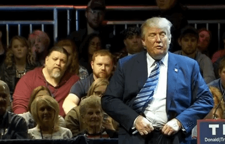 Donald Trump flips his belt buckle to mock Ben Carson. CREDIT: CNN video
