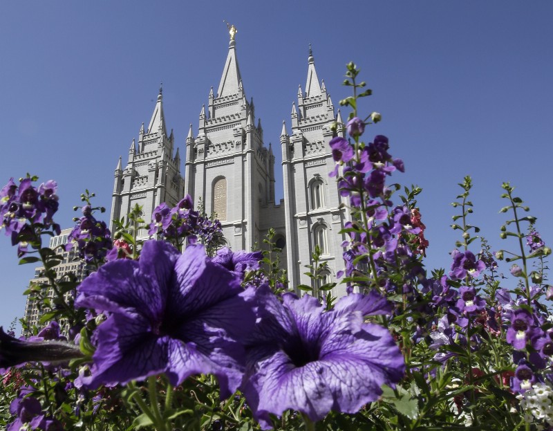 FILE- In this Sept. 3, 2014, file photo, shows flowers blooming in front of the Salt Lake Temple. in Temple Square, in Salt Lake City. Mormon church leaders are making a national appeal for a “balanced approach” in the clash between gay rights and religious freedom. The church is promising to support some housing and job protections for gays and lesbians in exchange for legal protections for believers who object to the behavior of others. (AP Photo/Rick Bowmer, File) CREDIT: AP PHOTO/RICK BOWMER