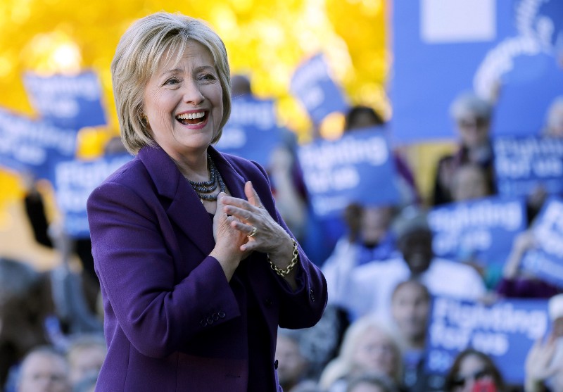 Democratic presidential candidate Hillary Rodham Clinton acknowledges supporters after filing papers to be on the nation’s earliest presidential primary ballot, Monday, Nov. 9, 2015, in Concord, N.H. CREDIT: AP PHOTO/JIM COLE
