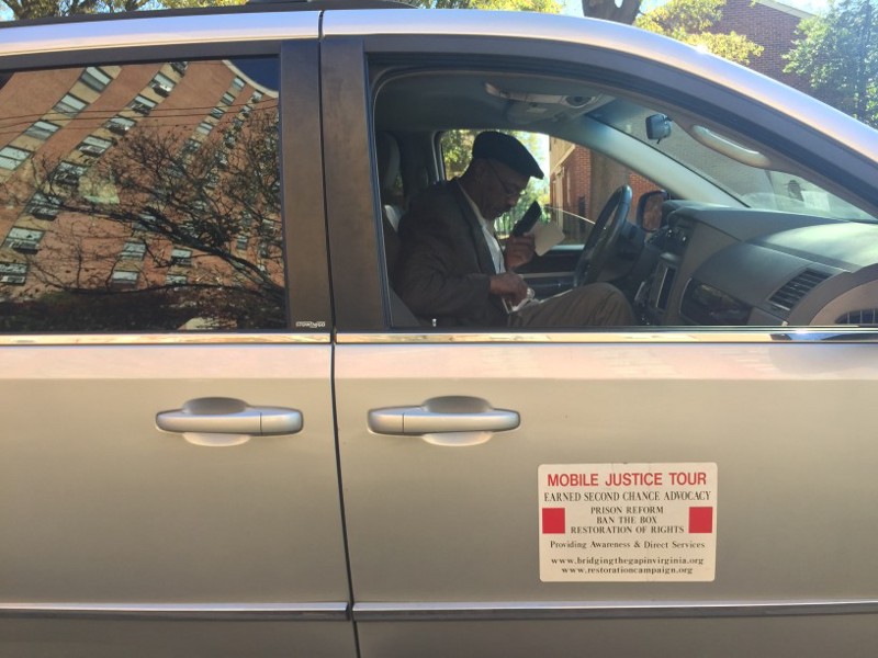 Richard Walker, founder of Bridging the Gap in Virginia, helps a woman on the phone figure out how to find her fiancee a job despite his felony conviction. CREDIT: Emily Atkin