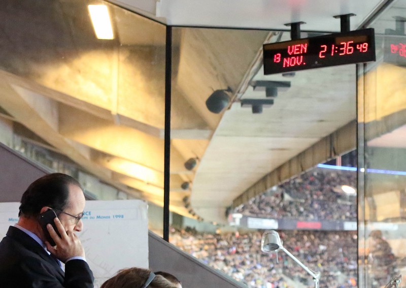 In this photo provided Friday, Nov. 13, 2015 by the French Presidential Palace, France’s President Francois Hollande is pictured in the security control room at the Stade de France stadium in Saint Denis, north of Paris, during the international friendly soccer match between France and Germany. CREDIT: FRENCH PRESIDENTIAL PALACE VIA AP