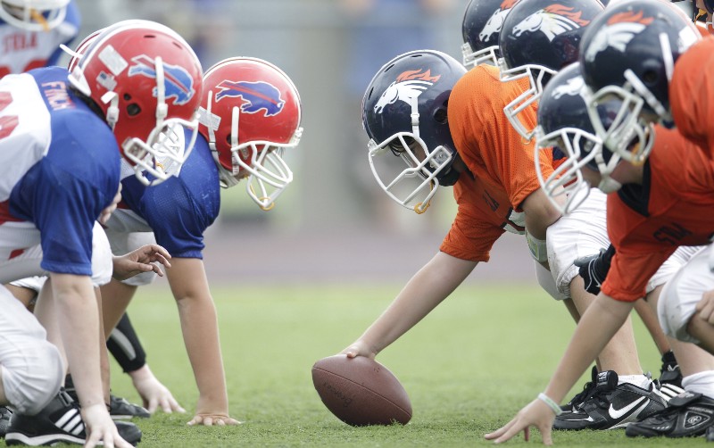 A 6th grade youth football game in Richardson, Texas. Some of the boys play with a new type of football helmet designed to reduce the risk of concussions. September 25, 2010 CREDIT: LM OTERO, AP