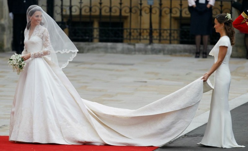 Kate Middleton and her sister, Pippa Middleton, as they arrive at Westminster Abbey at the Royal Wedding in London on Friday, APril 29, 2011. Both women are wearing dresses designed by Alexander McQueen creative director Sarah Burton. CREDIT: AP Photo/Alastair Grant