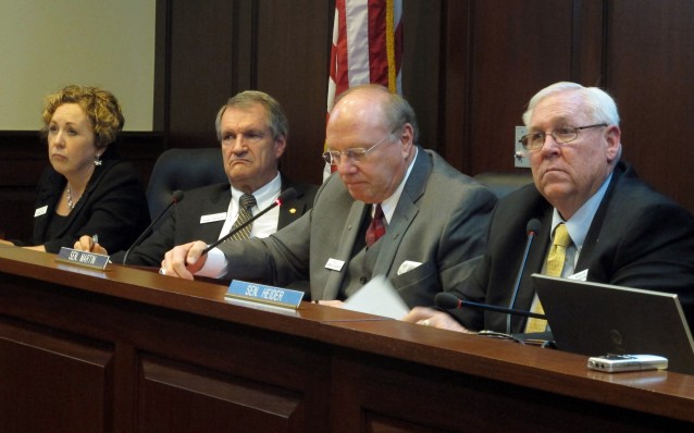 Sen. Lee Heider, center, of the Idaho Senate Health and Welfare Committee, listens after introducing a Feb. bill that would require doctors who perform abortions to obtain hospital admitting privileges. CREDIT: AP Photo, Kimberlee Kruesi