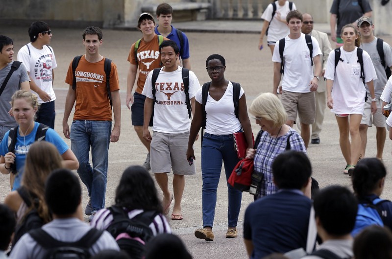 In this Thursday, Sept. 27, 2012 photo, students walk through the University of Texas at Austin campus in Austin, Texas. CREDIT: ERIC GAY, AP