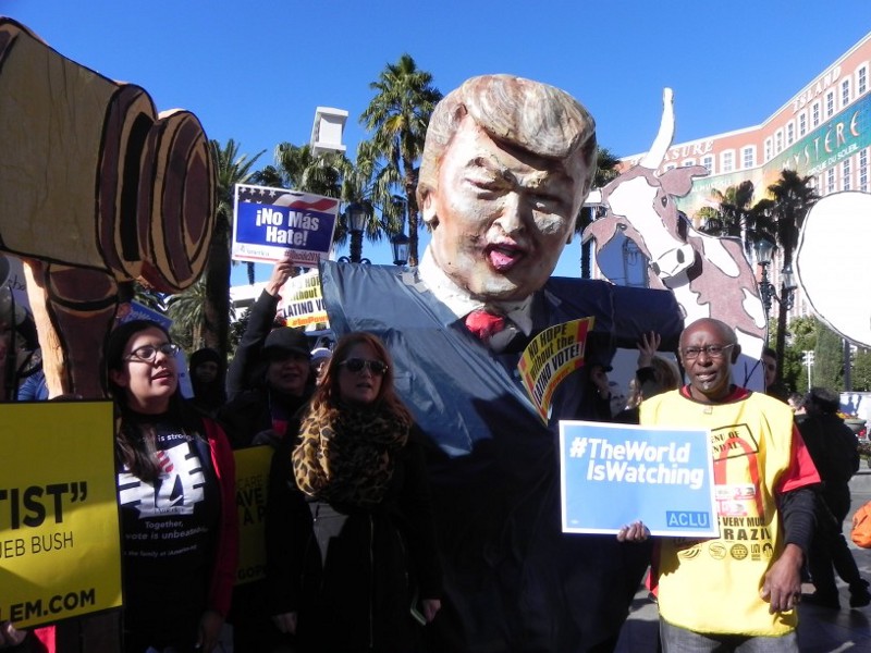 Activists holding a puppet likeness of Donald Trump picket outside the non-union hotel hosting Tuesday night’s GOP debate. CREDIT: Alice Ollstein