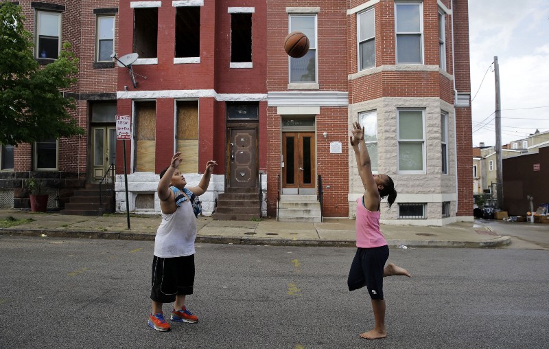 Children playing in Baltimore’s Sandtown-Winchester neighborhood CREDIT: AP PHOTO/PATRICK SEMANSKY