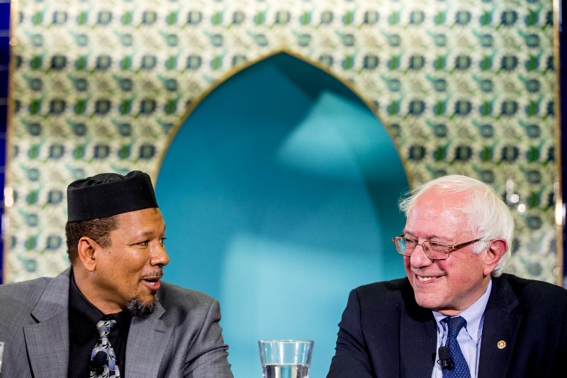 Democratic presidential candidate Sen. Bernie Sanders, I-Vt. listens as Imam Talib Shareef speaks during an interfaith roundtable hosted by at Masjid Muhammad, the Nation’s Mosque in Washington, Wednesday, Dec. 16, 2015, for a discussion on standing up to anti-Muslim rhetoric. CREDIT: AP PHOTO/ANDREW HARNIK