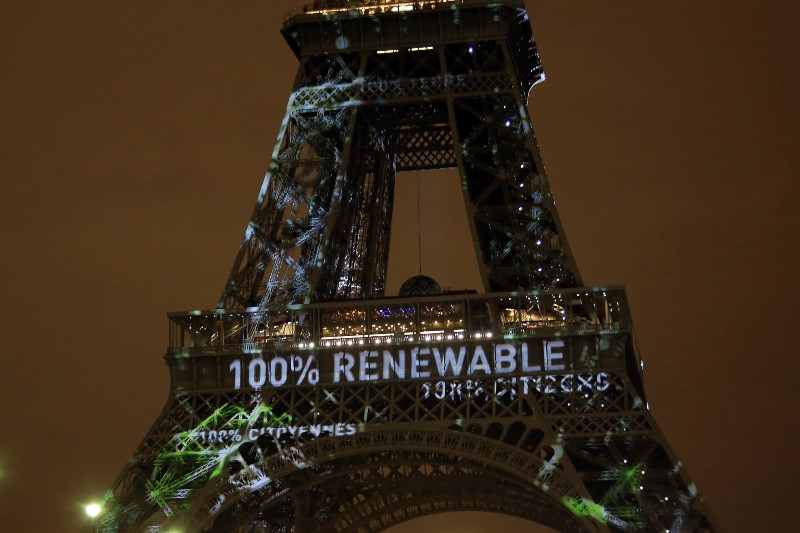 An artwork entitled ‘One Heart One Tree’ by artist Naziha Mestaoui is displayed on the Eiffel tower ahead of the 2015 Paris Climate Conference, in Paris. (AP Photo/Thibault Camus)