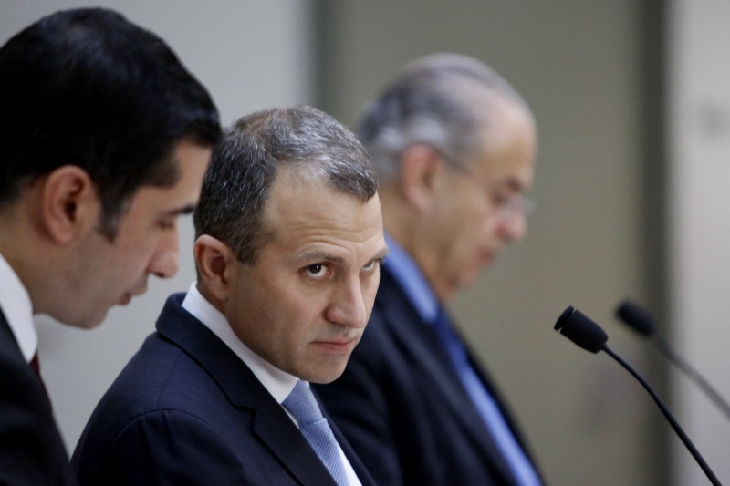 Minister of Foreign Affairs of Lebanon, Gebran Bassil, center, listens to a translator. CREDIT: AP PHOTO/PETROS KARADJIAS